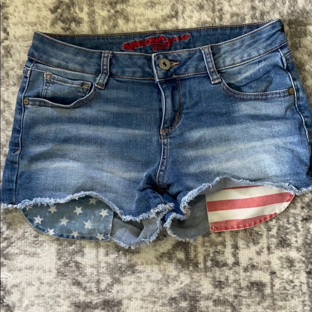 Blue jean shorts with American flag pockets